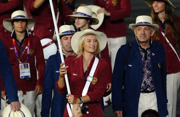 LONDON, ENGLAND - JULY 27: Maria Sharapova of the Russia Olympic tennis team carries her country's flag during the Opening Ceremony of the London 2012 Olympic Games at the Olympic Stadium on July 27, 2012 in London, England. (Photo by Laurence Griffiths/Getty Images)